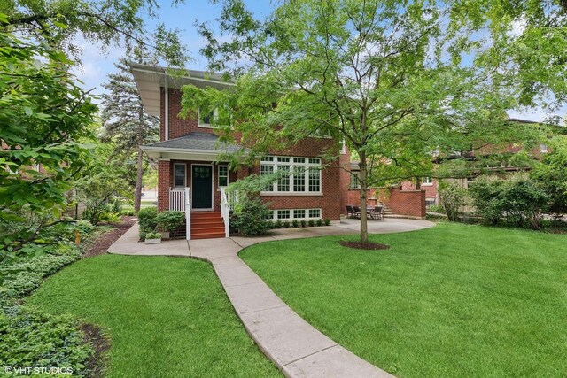 739 Jackson Ave, River Forest, IL 60305 - view of front of home featuring brick siding, a front lawn, and a patio
