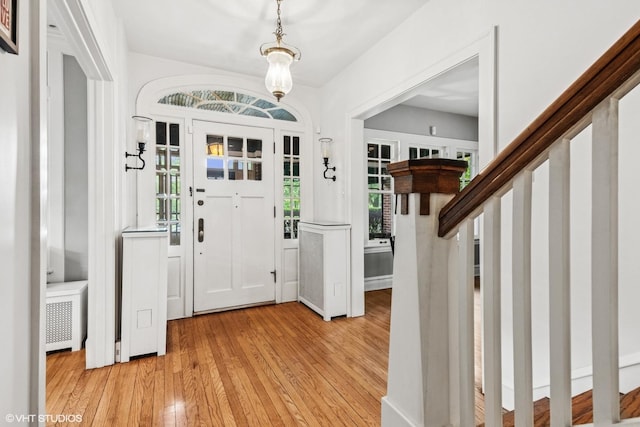739 Jackson Ave, River Forest, IL 60305 - entryway with light wood-style flooring and radiator heating unit