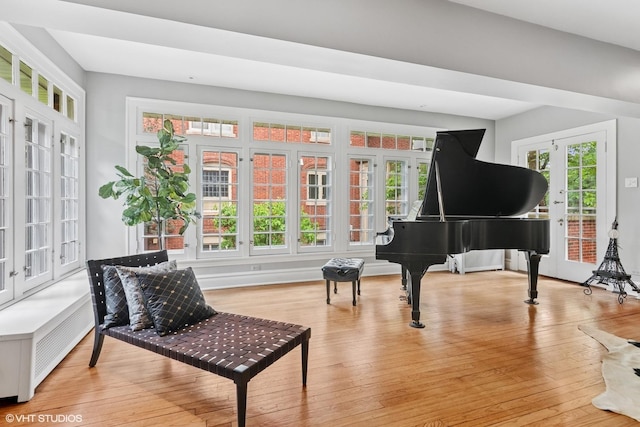 739 Jackson Ave, River Forest, IL 60305 - living area featuring wood finished floors, french doors, and radiator
