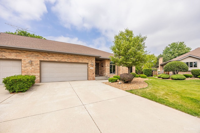 1658 Bayhill Dr, New Lenox, IL 60451 - view of front of home with concrete driveway, a front yard, brick siding, and an attached garage