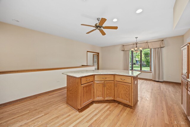 1658 Bayhill Dr, New Lenox, IL 60451 - kitchen featuring light wood-style flooring, ceiling fan, a center island, recessed lighting, and baseboards