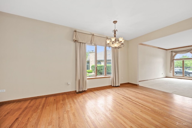 1658 Bayhill Dr, New Lenox, IL 60451 - unfurnished room featuring a chandelier, baseboards, and light wood finished floors