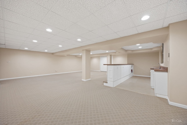 1658 Bayhill Dr, New Lenox, IL 60451 - finished below grade area featuring light colored carpet, baseboards, bar area, recessed lighting, and a paneled ceiling