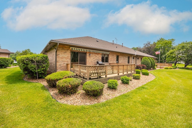 1658 Bayhill Dr, New Lenox, IL 60451 - back of house featuring brick siding, a yard, a wooden deck, and roof with shingles