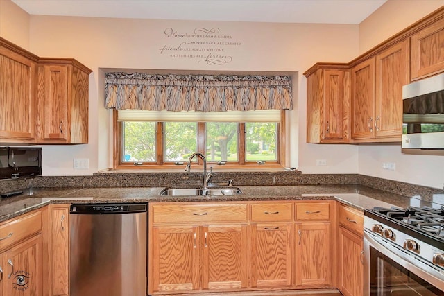 82 Whisper Creek Dr, New Lenox, IL 60451 - kitchen with stainless steel appliances, plenty of natural light, dark stone counters, and brown cabinets