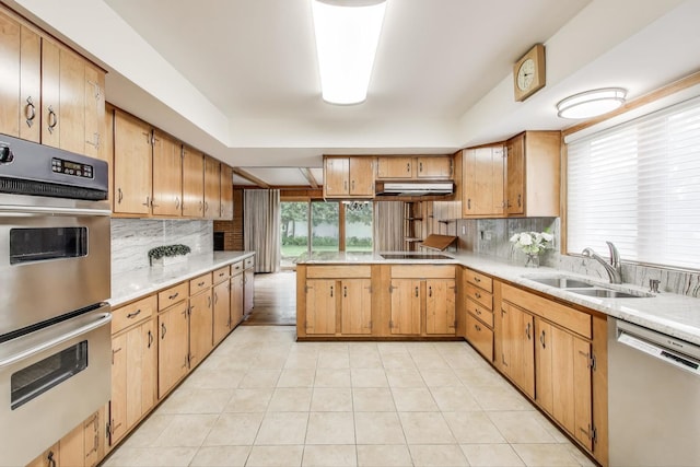 1904 Birch Rd, Northbrook, IL 60062 - kitchen featuring dishwashing machine, stainless steel double oven, under cabinet range hood, light countertops, and decorative backsplash
