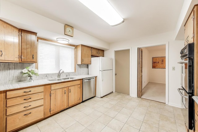 1904 Birch Rd, Northbrook, IL 60062 - kitchen with stainless steel appliances, light countertops, decorative backsplash, and light tile patterned floors