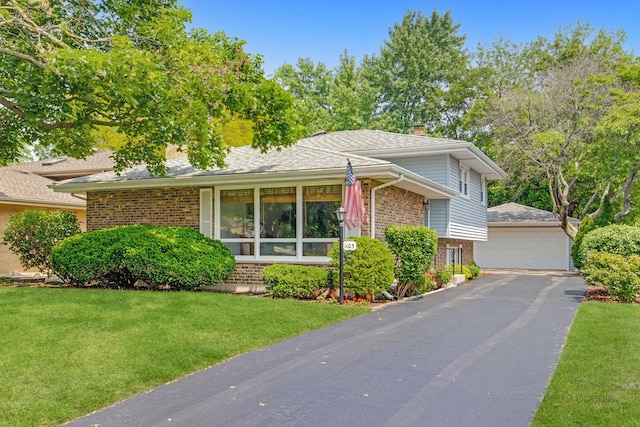 1103 S Belmont Ave, Arlington Heights, IL 60005 - tri-level home with brick siding, a front yard, a detached garage, an outbuilding, and a chimney