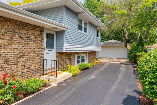 1103 S Belmont Ave, Arlington Heights, IL 60005 - view of side of property with brick siding, a garage, and an outdoor structure