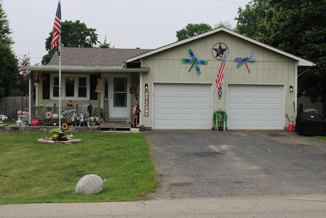 907 N Eddy St, Sandwich, IL 60548 - ranch-style home featuring a front yard, a garage, asphalt driveway, and roof with shingles