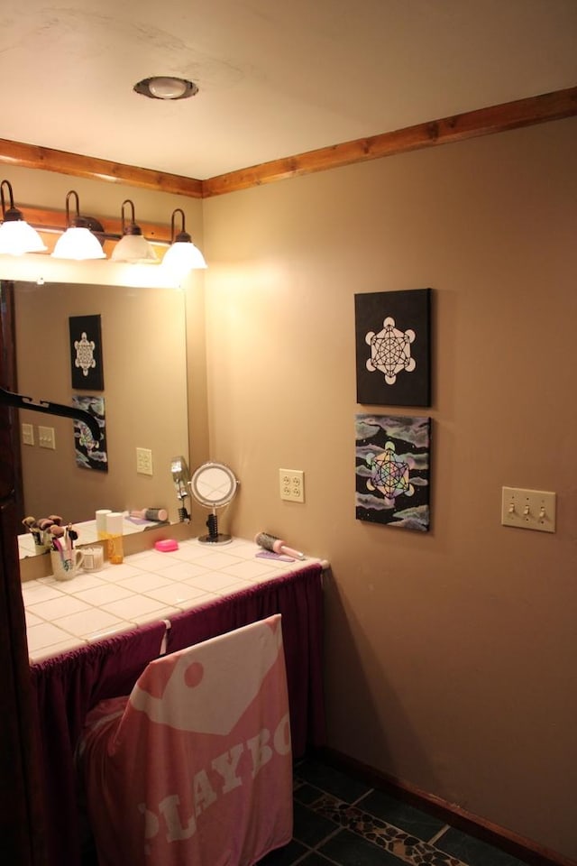 907 N Eddy St, Sandwich, IL 60548 - bathroom with tile patterned flooring, vanity, and baseboards