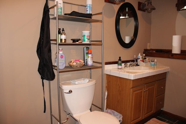 907 N Eddy St, Sandwich, IL 60548 - half bathroom with vanity, toilet, and tile patterned floors