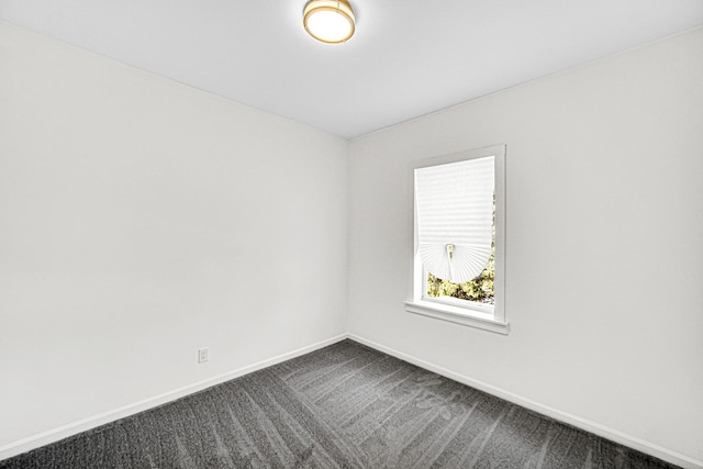 11357 S Indiana Ave, Chicago, IL 60628 - empty room featuring baseboards and dark carpet
