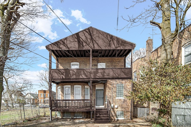 11357 S Indiana Ave, Chicago, IL 60628 - view of front facade with brick siding and a balcony
