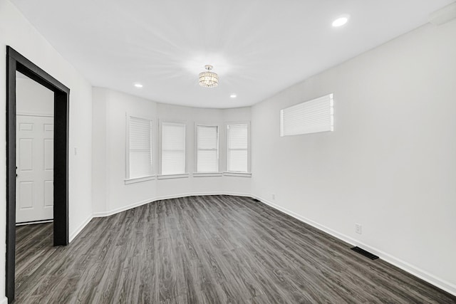 11357 S Indiana Ave, Chicago, IL 60628 - spare room featuring dark wood-style flooring, recessed lighting, and a chandelier