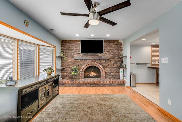 1N559 Newton Ave, Glen Ellyn, IL 60137 - living area with a ceiling fan, a brick fireplace, wood finished floors, recessed lighting, and baseboards