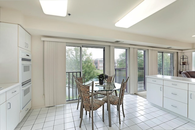 422 Kelburn Rd Unit 223, Deerfield, IL 60015 - dining space featuring plenty of natural light and light tile patterned floors