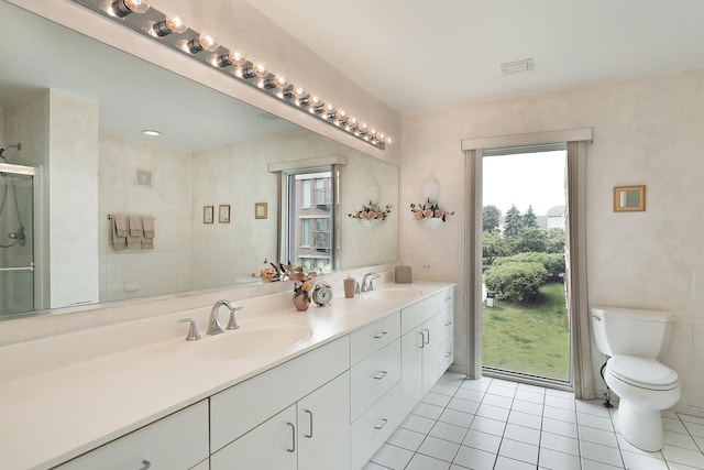 422 Kelburn Rd Unit 223, Deerfield, IL 60015 - bathroom featuring double vanity, tile patterned flooring, and a shower with door