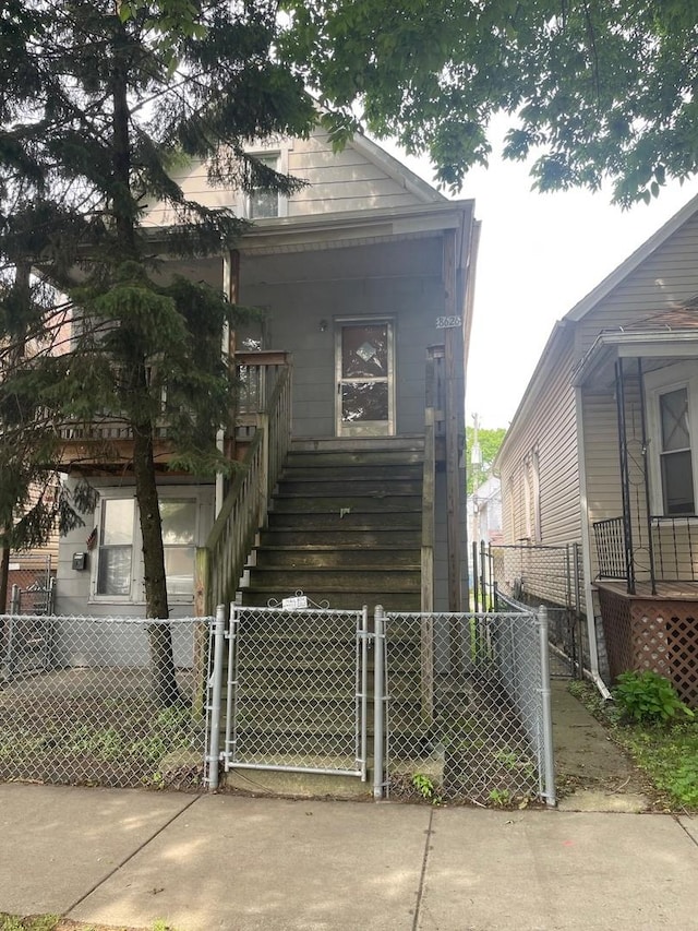 8626 S Burnham Ave, Chicago, IL 60617 - view of side of property with a gate and stairs