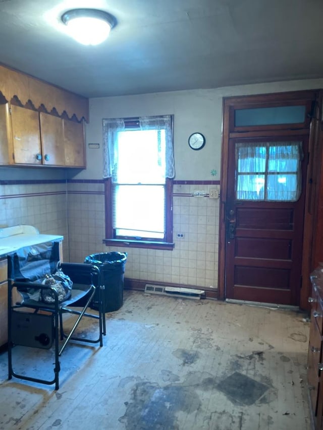 8626 S Burnham Ave, Chicago, IL 60617 - entryway with tile walls, hardwood / wood-style flooring, and a wainscoted wall