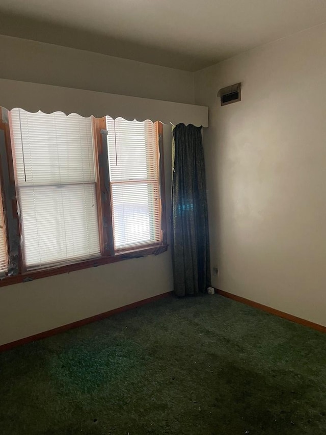 8626 S Burnham Ave, Chicago, IL 60617 - carpeted empty room with baseboards