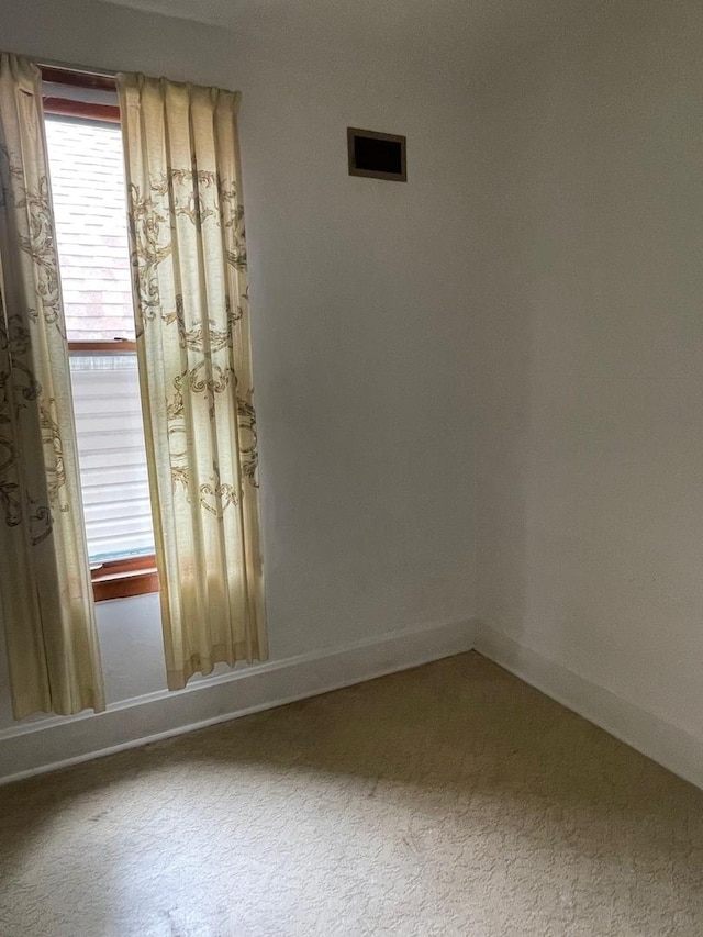 8626 S Burnham Ave, Chicago, IL 60617 - spare room featuring carpet and baseboards