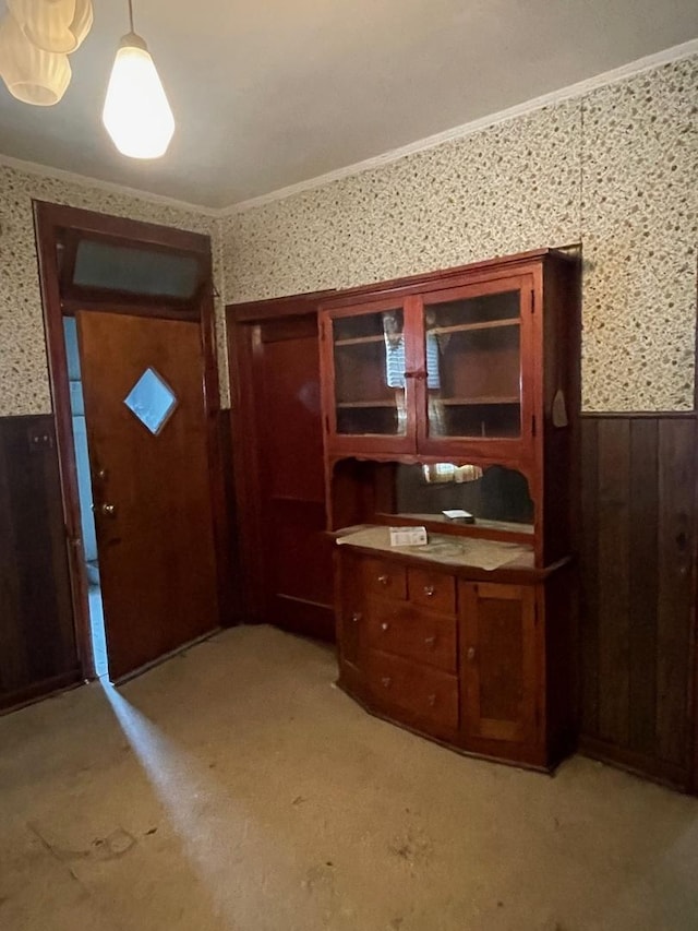 8626 S Burnham Ave, Chicago, IL 60617 - interior space featuring wallpapered walls, wainscoting, ornamental molding, wood walls, and light carpet