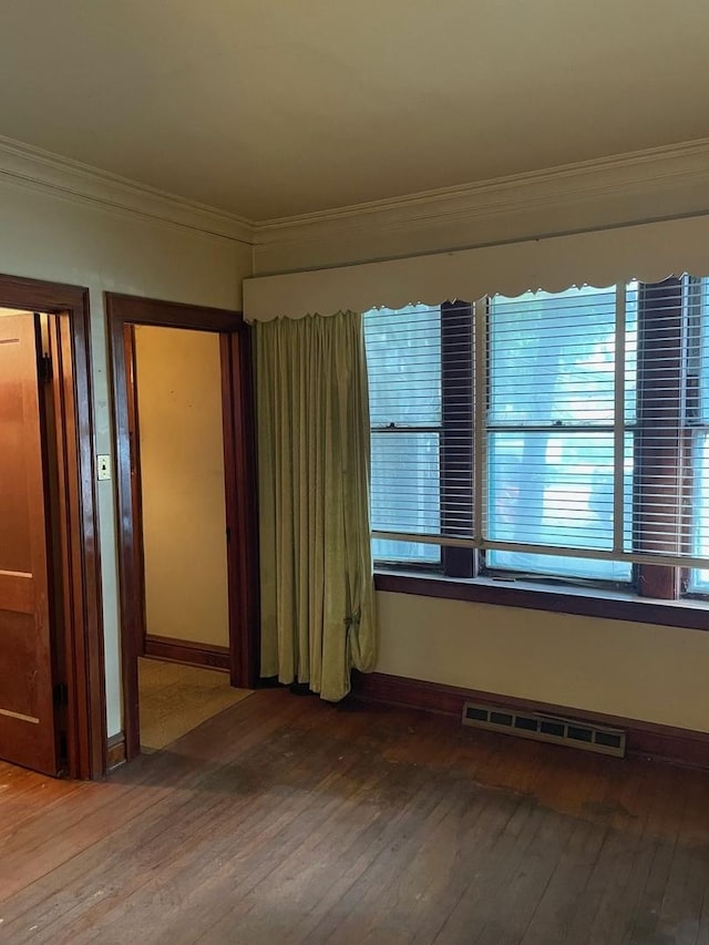 8626 S Burnham Ave, Chicago, IL 60617 - spare room with hardwood / wood-style floors, crown molding, and baseboards