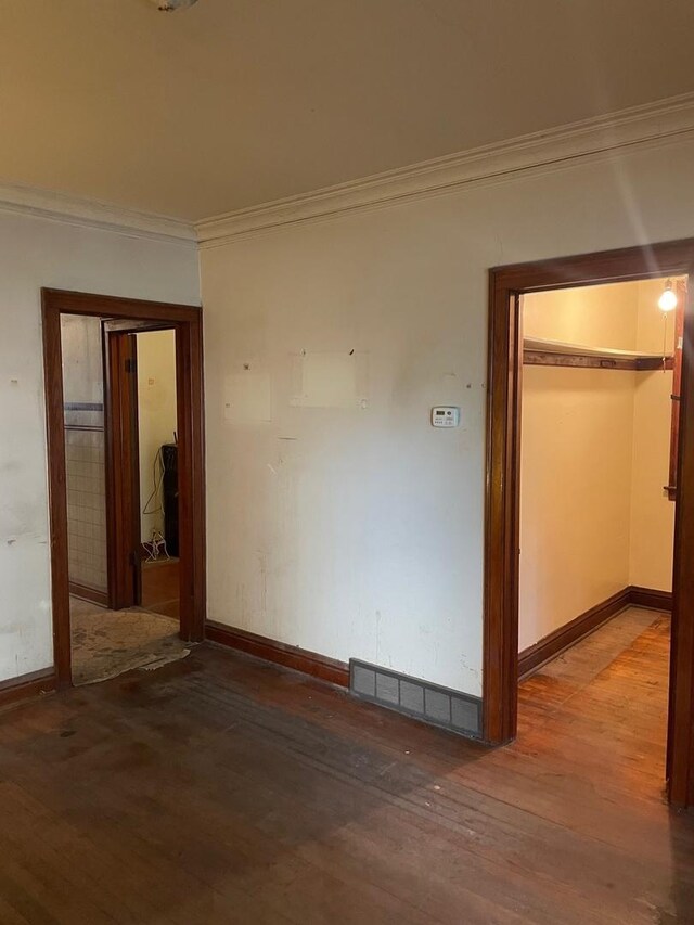 8626 S Burnham Ave, Chicago, IL 60617 - spare room with ornamental molding, hardwood / wood-style floors, and baseboards