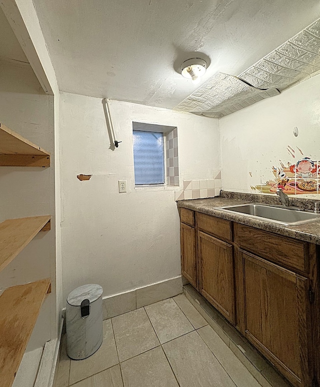 2717 W 38th St, Chicago, IL 60632 - laundry area featuring a sink and light tile patterned floors