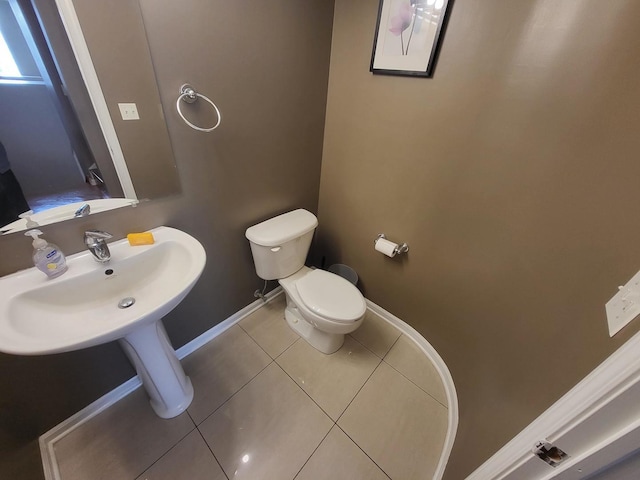 3041 W Pope John Paul Ii Dr, Chicago, IL 60638 - bathroom with toilet, baseboards, and tile patterned floors