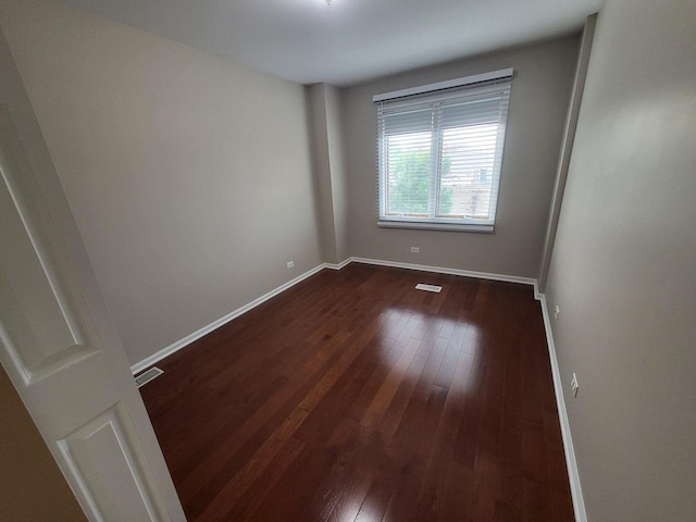 3041 W Pope John Paul Ii Dr, Chicago, IL 60638 - spare room with dark wood finished floors and baseboards