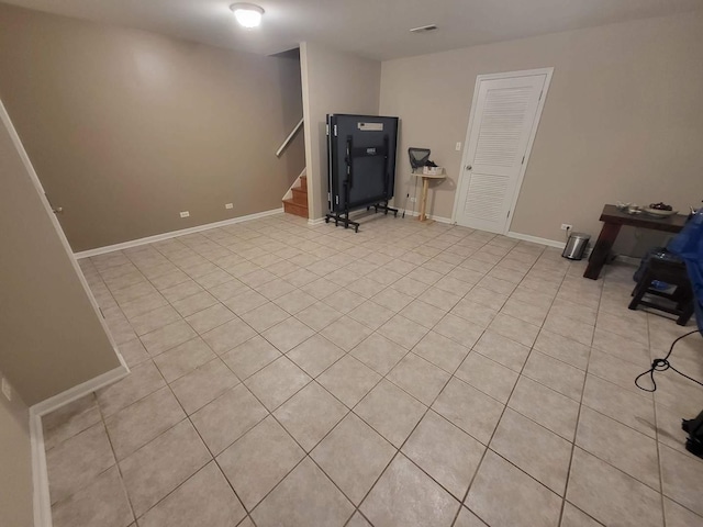 3041 W Pope John Paul Ii Dr, Chicago, IL 60638 - finished below grade area with stairs, light tile patterned floors, and baseboards