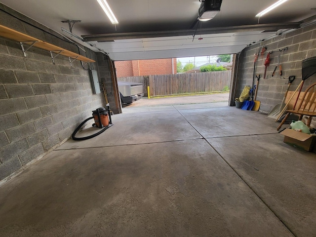 3041 W Pope John Paul Ii Dr, Chicago, IL 60638 - garage featuring concrete block wall and a garage door opener