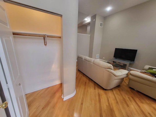 3041 W Pope John Paul Ii Dr, Chicago, IL 60638 - living room featuring light wood-style flooring and baseboards