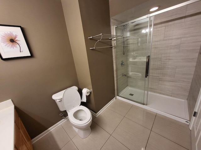 3041 W Pope John Paul Ii Dr, Chicago, IL 60638 - full bathroom with tile patterned floors, toilet, a stall shower, and baseboards