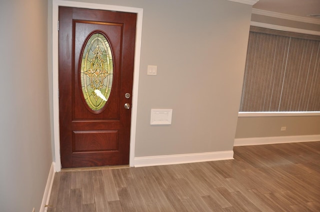 207 Mantua St, Park Forest, IL 60466 - entryway featuring wood finished floors, baseboards, and ornamental molding