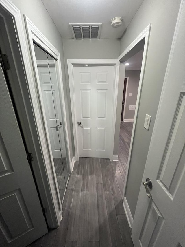 207 Mantua St, Park Forest, IL 60466 - hallway featuring dark wood-style flooring and baseboards