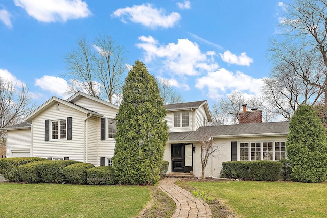 911 Travers Ln, Flossmoor, IL 60422 - traditional home featuring a chimney and a front lawn