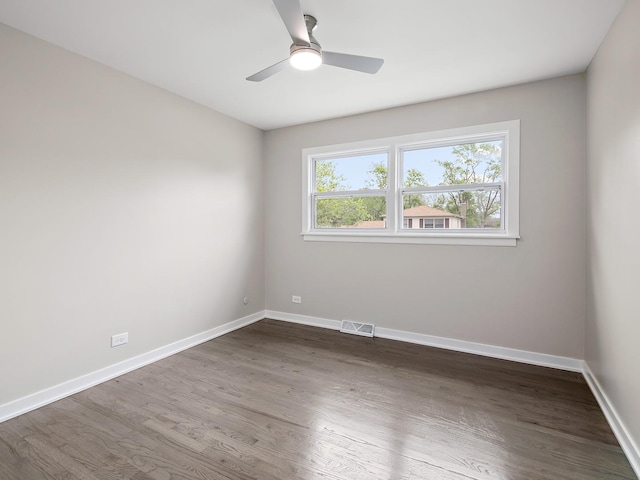 17708 Pebblewood Ln, Hazel Crest, IL 60429 - spare room with dark wood finished floors, baseboards, and ceiling fan