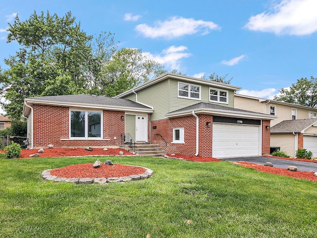 17708 Pebblewood Ln, Hazel Crest, IL 60429 - split level home with driveway, brick siding, a front lawn, and a garage