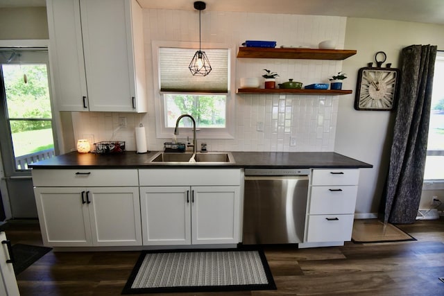 401 W Boundary St, Stanford, IL 61774 - kitchen featuring stainless steel dishwasher, a sink, dark countertops, and backsplash