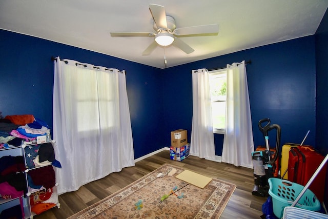 401 W Boundary St, Stanford, IL 61774 - bedroom featuring wood finished floors, a ceiling fan, and baseboards