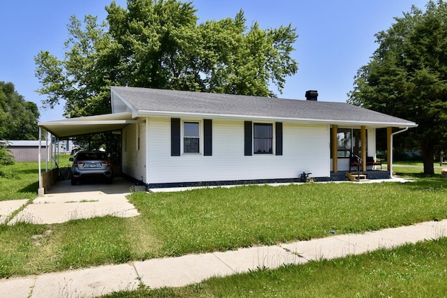 401 W Boundary St, Stanford, IL 61774 - view of front facade featuring driveway, an attached carport, a front yard, and covered porch