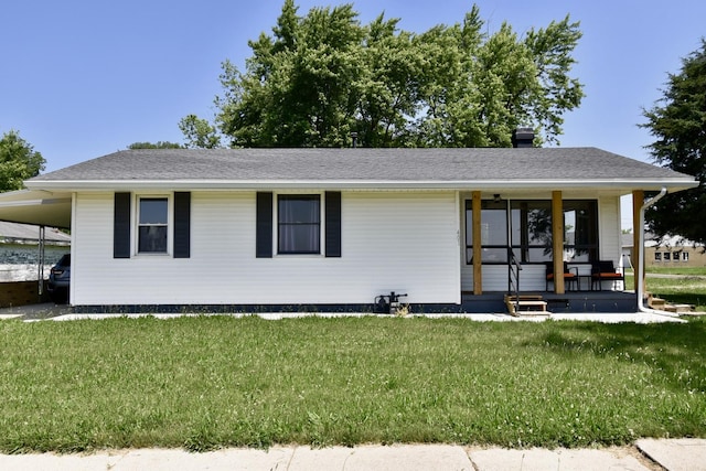 401 W Boundary St, Stanford, IL 61774 - view of front of home featuring a front yard, a porch, and an attached carport