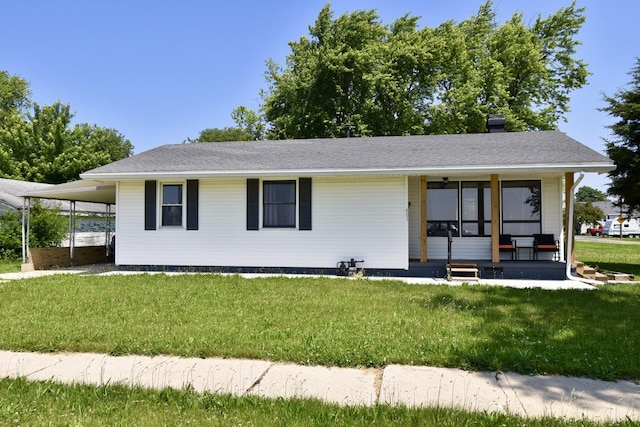 401 W Boundary St, Stanford, IL 61774 - view of front of home featuring a front yard, an attached carport, and a chimney