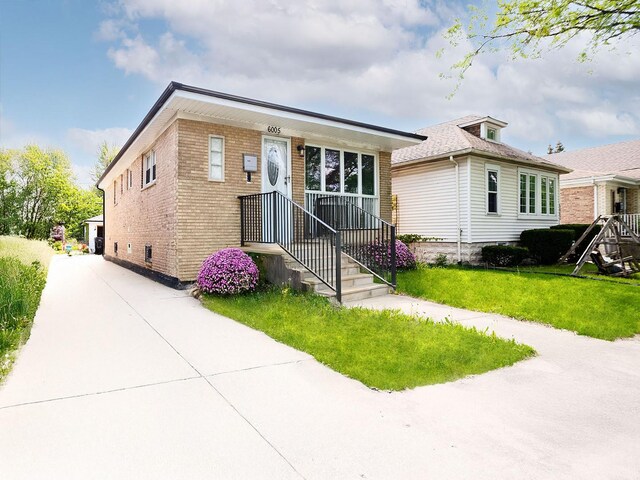 6005 N Canfield Ave, Chicago, IL 60631 - view of front facade with a front yard