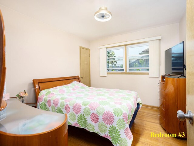 6005 N Canfield Ave, Chicago, IL 60631 - bedroom with wood finished floors and baseboards