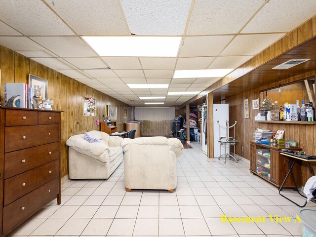 6005 N Canfield Ave, Chicago, IL 60631 - living area with wood walls, a drop ceiling, and light tile patterned flooring