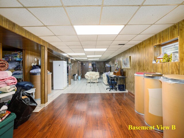 6005 N Canfield Ave, Chicago, IL 60631 - below grade area with a paneled ceiling, wood finished floors, and wood walls